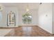 Dining room with tile floors, large windows with treatments, and neutral wall paint at 5720 Almar Dr, Punta Gorda, FL 33950