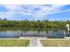 Waterfront dock featuring lush greenery and picturesque scenery, perfect for relaxation at 5720 Almar Dr, Punta Gorda, FL 33950