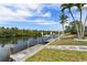 Lovely waterfront dock with boat lift amidst lush greenery, perfect for relaxation at 5720 Almar Dr, Punta Gorda, FL 33950