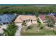 Lovely waterfront home with a manicured lawn and mature palm trees at 5720 Almar Dr, Punta Gorda, FL 33950