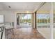 Kitchen bar area looking out to the pool with tile floor, cabinets, and seating at 5720 Almar Dr, Punta Gorda, FL 33950