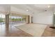 Spacious living room featuring tile floors, neutral paint, and sliding glass doors to the lanai at 5720 Almar Dr, Punta Gorda, FL 33950