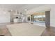 Spacious living room with tile floor, high ceilings, and sliding glass doors leading to pool at 5720 Almar Dr, Punta Gorda, FL 33950