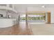 Bright living area featuring a breakfast bar, modern appliances, and access to the lanai and pool at 5720 Almar Dr, Punta Gorda, FL 33950