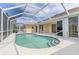 Enclosed pool area with a swimming pool, patio, and view of the house, ideal for leisure and relaxation at 5720 Almar Dr, Punta Gorda, FL 33950