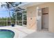 Outdoor pool area next to a river with direct access to an outdoor shower with screened enclosure at 5720 Almar Dr, Punta Gorda, FL 33950