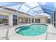 Inviting pool with a screened enclosure and a clear view of the interioir and patio at 5720 Almar Dr, Punta Gorda, FL 33950