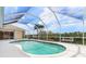 Screened pool area showcasing the pool, waterfront views, and outdoor space for recreation at 5720 Almar Dr, Punta Gorda, FL 33950
