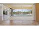 Bright sunroom with tile floor, ceiling fan, and sliding glass doors open to pool and lush backyard at 5720 Almar Dr, Punta Gorda, FL 33950