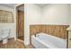 Bathroom showcasing a tub and tiled shower with glass door at 6405 Alan Blvd, Punta Gorda, FL 33982