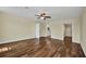 Large bedroom with wood floors, adjoining bathroom and walk-in closet at 6405 Alan Blvd, Punta Gorda, FL 33982