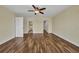 A large bedroom with wood floors and access to other rooms at 6405 Alan Blvd, Punta Gorda, FL 33982