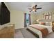 Cozy bedroom with neutral carpet, ceiling fan, and natural light at 6405 Alan Blvd, Punta Gorda, FL 33982