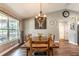 Dining room with wooden table, chairs, chandelier, and farmhouse decor at 6405 Alan Blvd, Punta Gorda, FL 33982