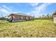 Ranch house featuring a large, covered porch and spacious yard at 6405 Alan Blvd, Punta Gorda, FL 33982