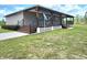 Ranch house featuring a large, covered porch and spacious yard at 6405 Alan Blvd, Punta Gorda, FL 33982