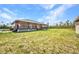 Sprawling ranch-style house featuring a large covered porch and a spacious yard at 6405 Alan Blvd, Punta Gorda, FL 33982