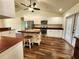 Bright kitchen with white cabinets, wood countertops, stainless steel appliances and a central island at 6405 Alan Blvd, Punta Gorda, FL 33982