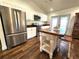 Bright kitchen features stainless steel appliances, wooden countertops and an island with seating at 6405 Alan Blvd, Punta Gorda, FL 33982