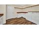 Laundry room features white cabinets, wood countertops, laundry sink and a new washer/dryer unit at 6405 Alan Blvd, Punta Gorda, FL 33982
