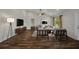 Bright living room featuring modern furnishings, wood floors, and a ceiling fan at 6405 Alan Blvd, Punta Gorda, FL 33982