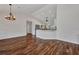 Spacious living room with hardwood floors and open kitchen layout, perfect for entertaining at 6405 Alan Blvd, Punta Gorda, FL 33982