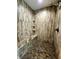 Walk-in shower featuring a bench, overhead shower, and tile surround at 6405 Alan Blvd, Punta Gorda, FL 33982