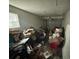 Garage interior featuring an overhead door and natural light from the window at 8782 La Boca Ave, North Port, FL 34287