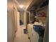 Hallway to laundry room, complete with washer and dryer at 8782 La Boca Ave, North Port, FL 34287