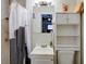 Compact bathroom features a toilet, sink, mirror, vanity and shower-tub combination at 8795 56Th N St, Pinellas Park, FL 33782