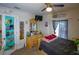Bright bedroom featuring a ceiling fan, dresser, and mounted TV for a cozy and relaxing space at 8795 56Th N St, Pinellas Park, FL 33782