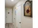 Hallway featuring white doors, baseboards, and wall decor at 8795 56Th N St, Pinellas Park, FL 33782
