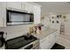 Well-equipped kitchen with granite countertops, stainless steel appliances, and ample cabinet space at 8795 56Th N St, Pinellas Park, FL 33782