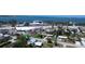 Aerial view showcasing a cozy white house near the water, businesses, and local amenities at 899 S Broadway, Englewood, FL 34223