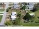 An aerial view shows the property with a spacious lot in a serene neighborhood setting at 899 S Broadway, Englewood, FL 34223