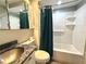 Bathroom with shower, tub, granite vanity, and medicine cabinet at 899 S Broadway, Englewood, FL 34223