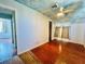 Bedroom featuring a sky painted ceiling, hardwood floors, and natural light at 899 S Broadway, Englewood, FL 34223