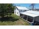 Exterior perspective of a white house with an attached porch, perfect for outdoor living at 899 S Broadway, Englewood, FL 34223