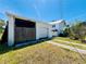 View of exterior with detached garage, driveway, and potential for landscaping at 899 S Broadway, Englewood, FL 34223