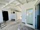 View of an outdoor space showing multiple entryways and ample natural light and access to the backyard at 899 S Broadway, Englewood, FL 34223