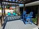 Beautiful deck with a pergola, bright furniture, and view of the backyard at 949 Springview Nw Ave, Port Charlotte, FL 33948