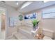 Bright bathroom featuring a tub with tile surround and decor at 949 Springview Nw Ave, Port Charlotte, FL 33948