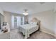 Cozy bedroom with plush carpet, natural light, and decorative chandelier at 949 Springview Nw Ave, Port Charlotte, FL 33948