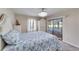 Comfortable bedroom with neutral walls, bright lighting, and outdoor access at 949 Springview Nw Ave, Port Charlotte, FL 33948