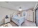 Comfortable bedroom featuring neutral walls, chandelier, and bright natural light at 949 Springview Nw Ave, Port Charlotte, FL 33948