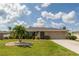 Charming single-story home featuring a well-maintained lawn and inviting curb appeal at 949 Springview Nw Ave, Port Charlotte, FL 33948