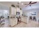 Charming kitchen with white cabinetry, granite countertops, stainless appliances, and views of the dining and living areas at 949 Springview Nw Ave, Port Charlotte, FL 33948