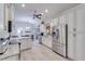 White kitchen with stainless appliances, granite countertops, open layout, and eat in bar at 949 Springview Nw Ave, Port Charlotte, FL 33948