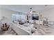 Comfortable living room with herringbone floors, a large window, and stylish furniture at 949 Springview Nw Ave, Port Charlotte, FL 33948