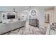 Spacious living room featuring stylish decor and a view into the adjacent kitchen at 949 Springview Nw Ave, Port Charlotte, FL 33948